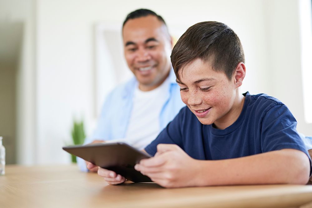 Boy-on-ipad-with-dad.jpg